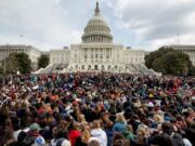 FILE- In this March 14, 2018, file photo, students rally outside the Capitol Building in Washington. Students risked disciplinary action at nearly 3,000 high schools in the first nationwide walkout for gun policy reform in March. According to a database maintained by the National Association for College Admission Counseling, hundreds of colleges nationwide have expressed support for student activists on Twitter and their websites.