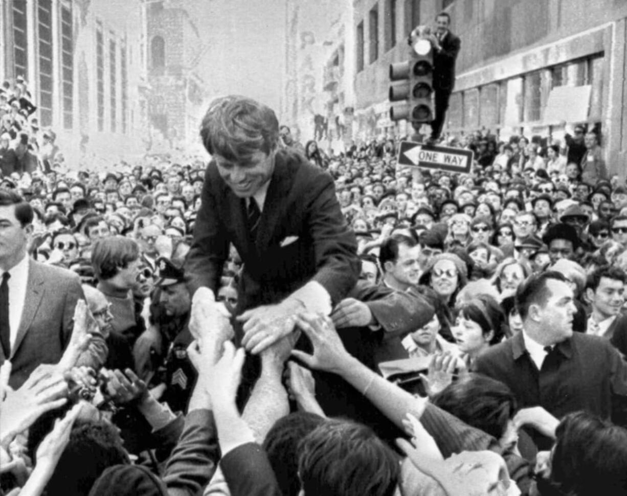 U.S. Sen. Robert F. Kennedy, D-NY, shakes hands with people in a crowd April 2, 1968, while campaigning for the Democratic party’s presidential nomination on a street corner, in Philadelphia. Nearly 50 years after Robert F. Kennedy’s assassination, a new documentary series on his life and transformation into a liberal hero is coming to Netflix. “Bobby Kennedy for President” produced by RadicalMedia, Trilogy Films and LooksFilm launches Friday, April 27, 2018, on Netflix.