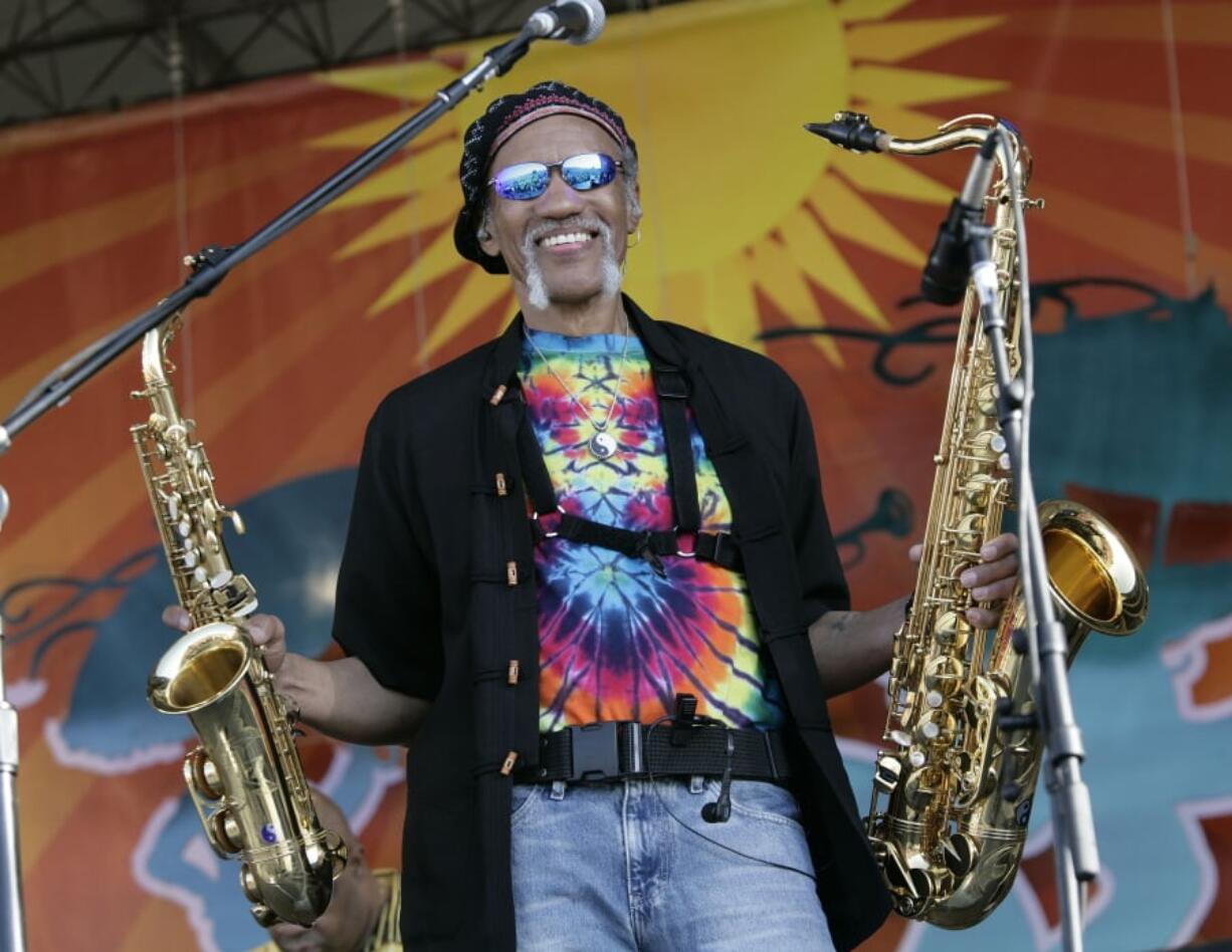 FILE - In a May 4, 2008 file photo, Charles Neville arrives with The Neville Brothers on stage to perform during the 2008 New Orleans Jazz & Heritage Festival at the New Orleans Fairgrounds Racetrack in New Orleans. New Orleans-born saxophone player Charles Neville has died at age 79. A publicist for Aaron Neville’s management agency confirmed the death in an email.