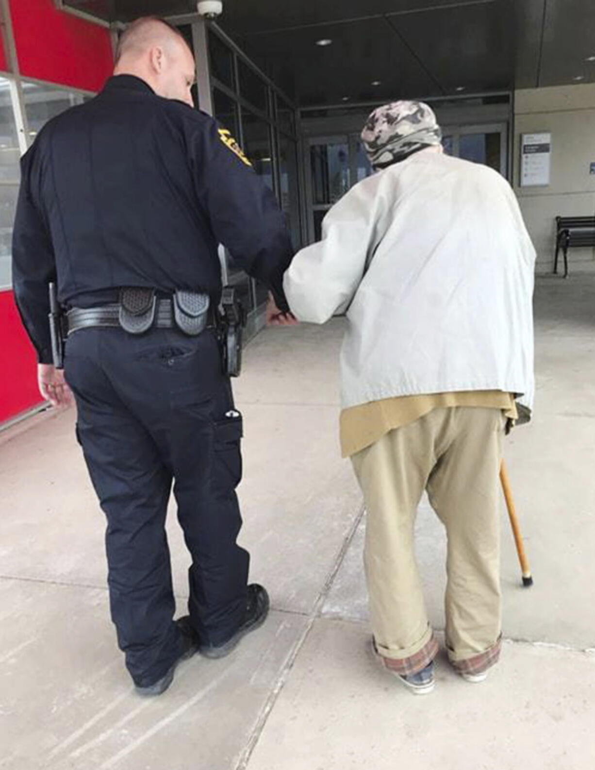 Jason Bentley, left, deputy chief of the department, escorts an 84-year-old man to see his wife, also 84, in the emergency department of UPMC Susquehanna hospital in Williamsport, Pa. After the elderly man’s wife had a medical emergency and was taken from the couple’s home by ambulance, Montoursville Police Chief Jeff Gyurina said he gave the man a patrol car’s cellphone number because the man couldn’t drive anymore and had no family in the area to take him to the hospital.