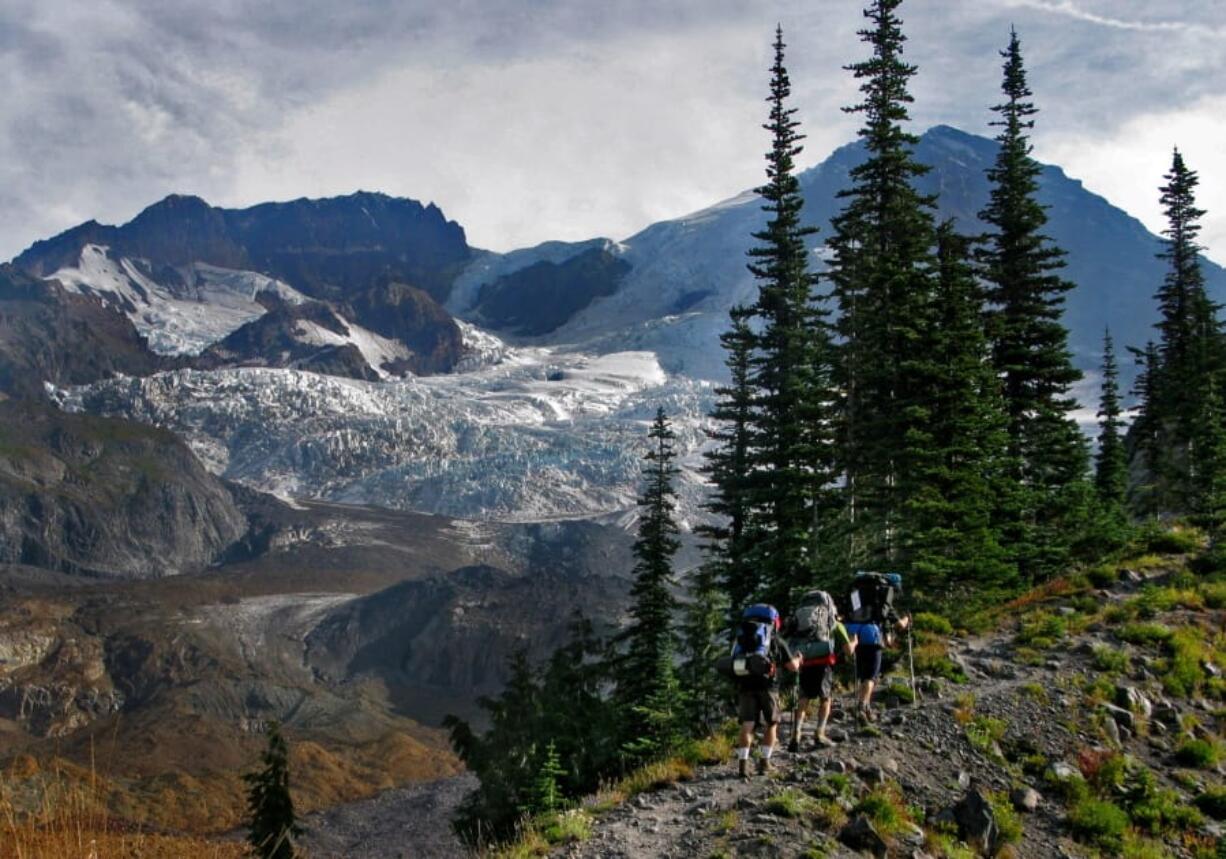 Hikers make their way toward the Tahoma Glacier on the Wonderland Trail at Mount Rainier National Park in 2012.