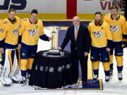 The changing of the guard begins at the top, where Nashville clinched its first Central Division title by running away with the league’s best record. Members of the team pose with the President’s Cup.