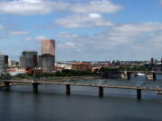 FILE - In this Aug. 1, 2012 file photo, the downtown skyline is shown on the west bank of the Willamette River in Portland, Ore. Officials say the backers of an effort to bring a professional baseball team to Portland have submitted formal proposals to buy sites to potentially build a stadium.