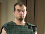 Jeremy Prevost, 25, makes a first appearance in Clark County Superior Court in Vancouver on Friday. Prevost is accused of pointing a bow and arrow at his sister and Clark County deputies.