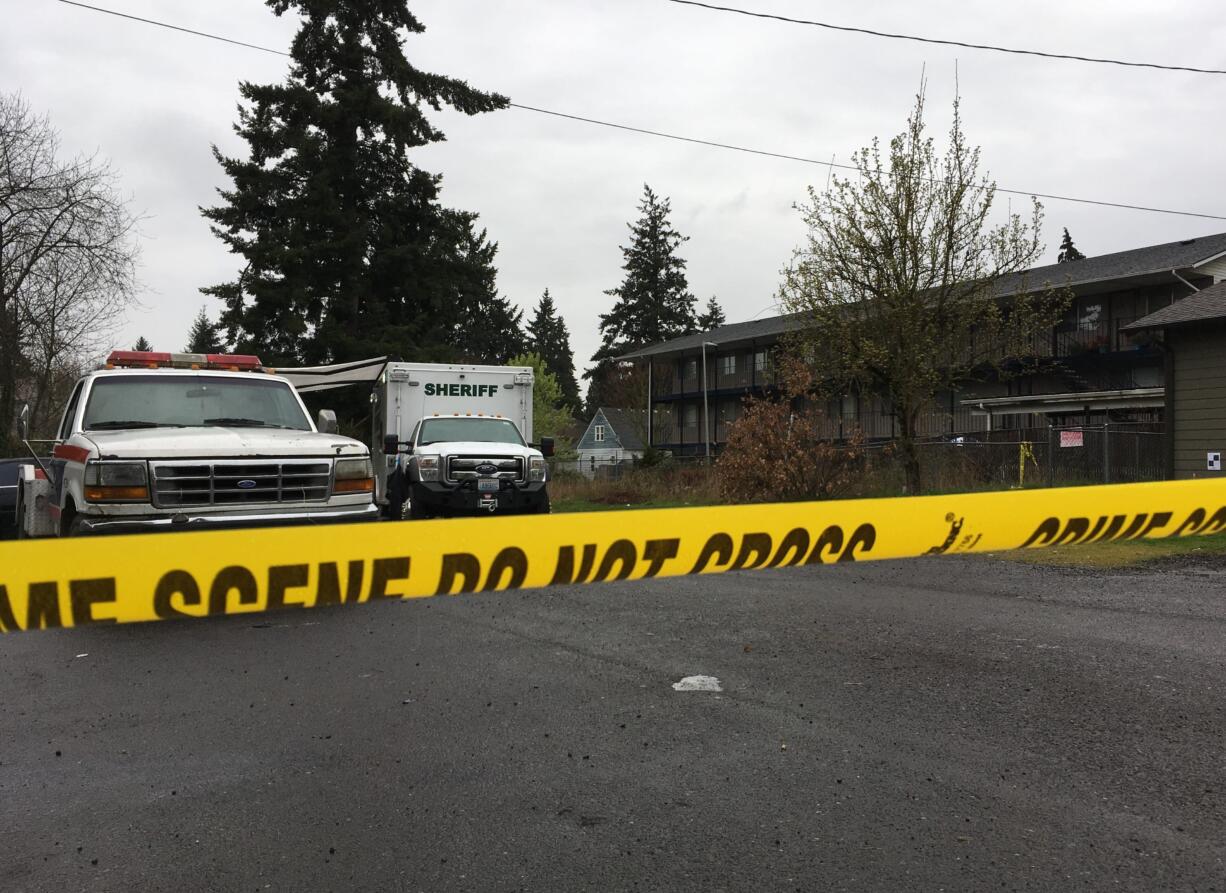 Clark County Sheriff's Office deputies with the Southwest Regional Major Crimes Unit investigate a crime scene at East 26th Street on in April.