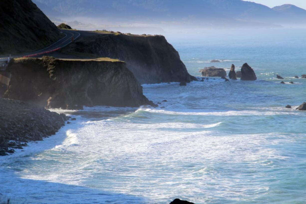 FILE - This March 29, 2018, file photo shows the scene of the fatal crash on the Mendocino coast near Mendocino, Calif., where the SUV carrying the Hart family off a cliff, killing all passengers. The SUV carrying the Hart family, from Woodland, Wash., accelerated straight off the scenic California cliff and authorities said the deadly wreck may have been intentional.