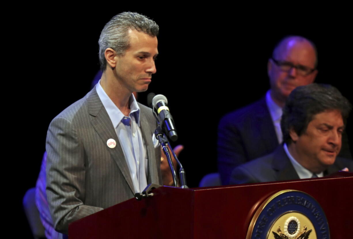 In this Tuesday, April 3, 2018 photo, Max Schachter, whose son Alex was killed during the deadly shooting at Marjory Stoneman Douglas High School, speaks to the audience during a congressional town hall on gun violence in Coral Springs, Fla. Schachter has formed the Marjory Stoneman Douglas School Safety Commission to find ways to make schools safer.