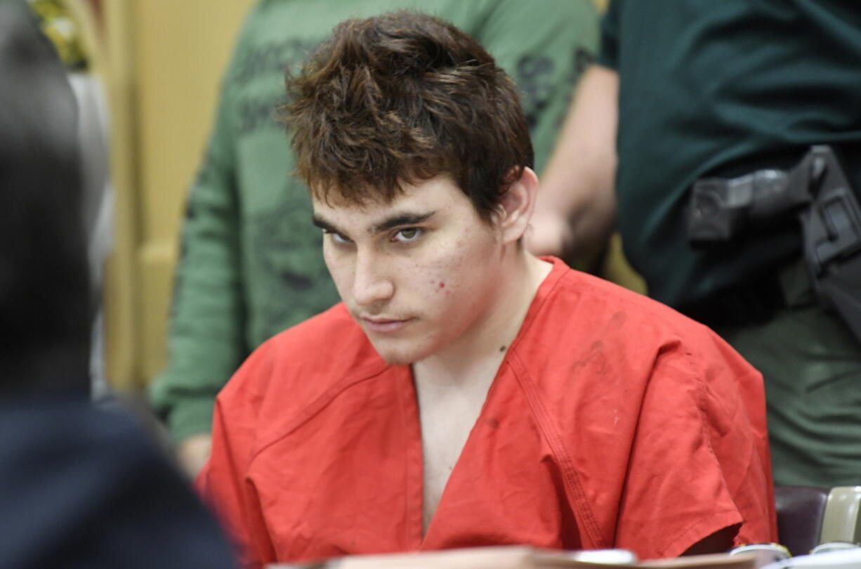 School shooting suspect Nikolas Cruz looks up while in court for a hearing Friday in Fort Lauderdale, Fla.