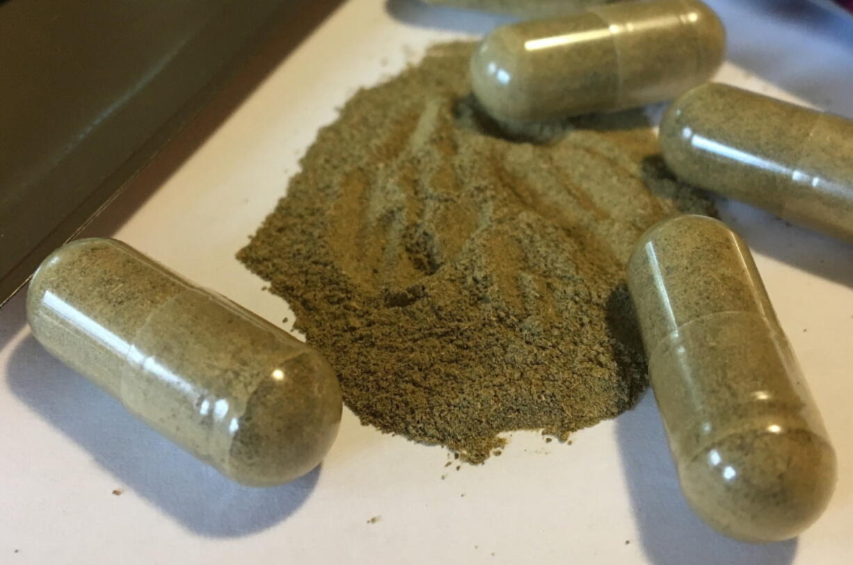 Kratom capsules are displayed in Albany, N.Y. U.S. health authorities are ordering a Las Vegas company to pull its herbal supplements off the market because some of its products tested positive for salmonella, part of a nationwide outbreak linked to the ingredient kratom. The Food and Drug Administration said Tuesday, April 3, 2018, it took the rare step of ordering the recall because Triangle Pharmanaturals refused to cooperate with regulators. Sold in various capsules and powders, kratom has gained popularity in the U.S. as an alternative treatment for pain, anxiety and drug dependence.