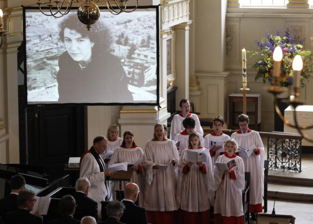 FILE - In this May 16, 2012, file photo, a choir performs a hymn during the memorial service for Marie Colvin, the Sunday Times war correspondent who was killed in Homs, Syria on Feb. 22, at St Martin-in-the-Fields church in central London. Syria President Bashar Assad’s forces targeted Colvin and then celebrated after they learned their rockets had killed her, according to a sworn statement a former Syrian intelligence officer made in a wrongful death suit filed by her relatives.