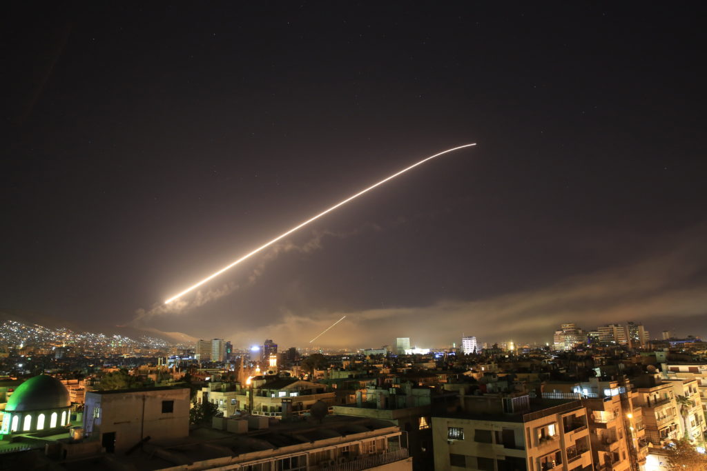 Damascus sky lights up with service to air missile fire as the U.S. launches an attack on Syria targeting different parts of the Syrian capital Damascus, Syria, early Saturday. Syria's capital has been rocked by loud explosions that lit up the sky with heavy smoke as U.S. President Donald Trump announced airstrikes in retaliation for the country's alleged use of chemical weapons.