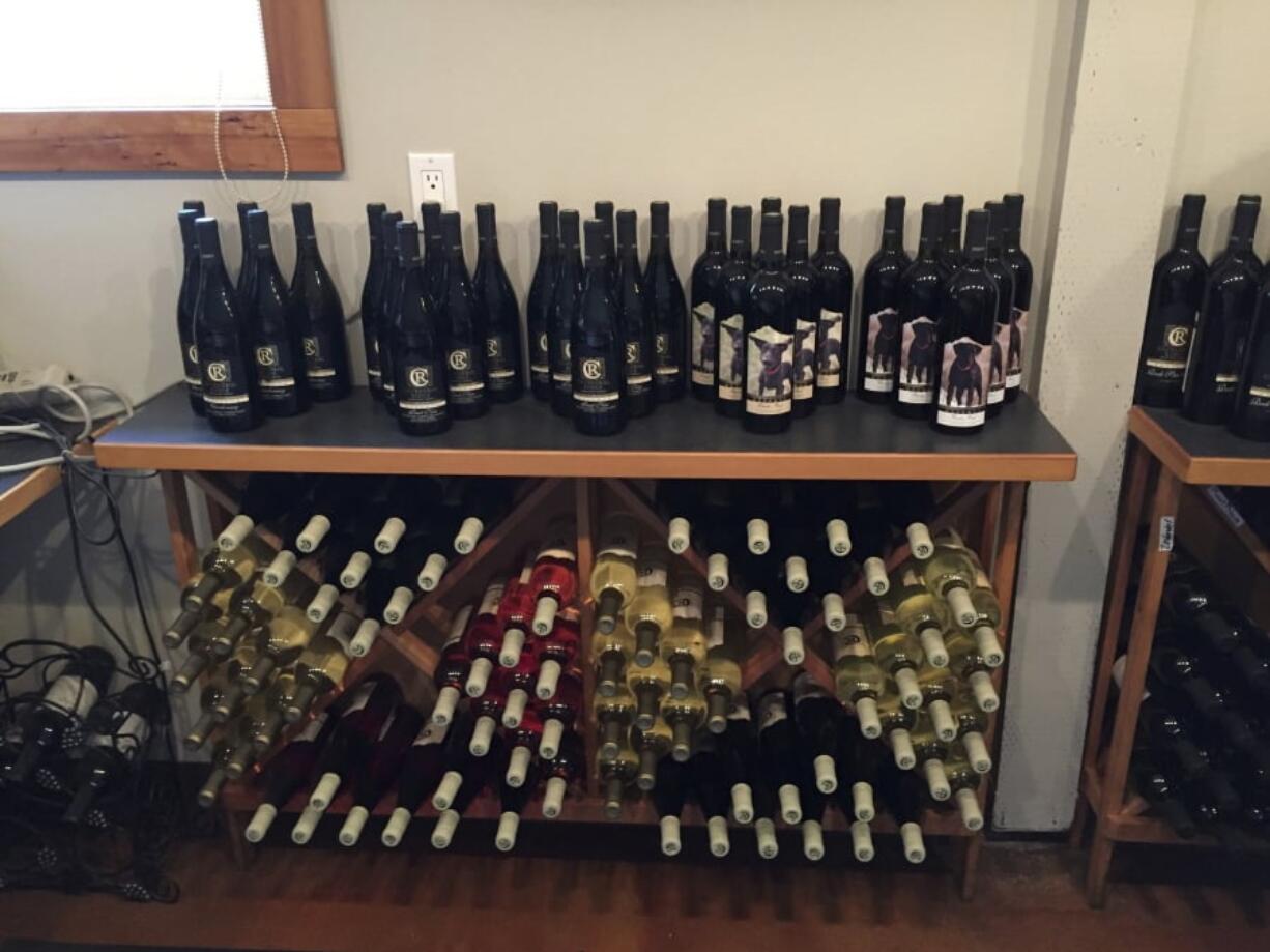 This Aug. 11, 2017 photo shows wine for sale at the Cathedral Ridge Winery in Hood River, Ore., in the Columbia River Gorge. Oregon’s Columbia River Gorge is known for spectacular waterfalls but it’s also famous for wine, with more than 40 wineries in 40 miles (60 kilometers). The Columbia Gorge is a designated American Viticultural Area, a wine grape region distinguished by geographic features.