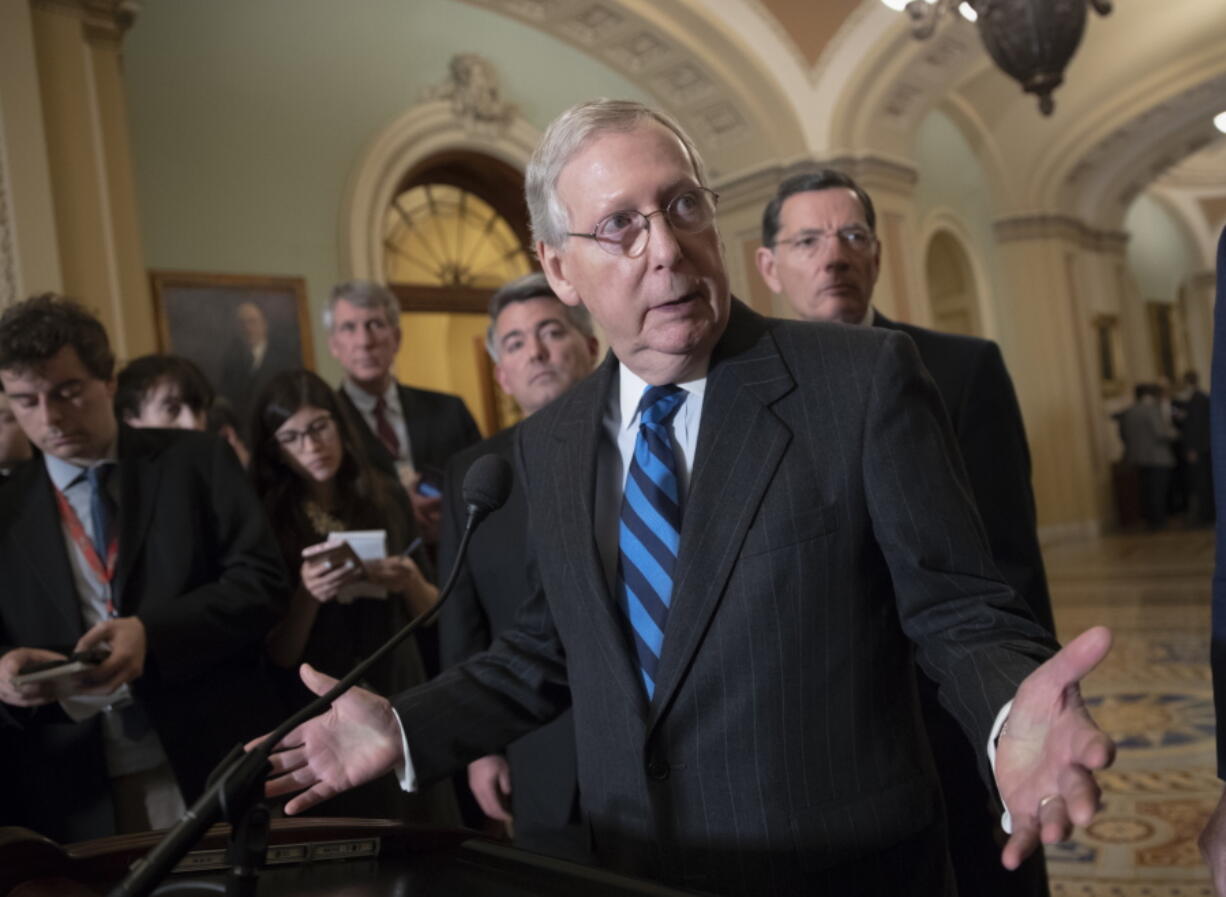 Senate Majority Leader Mitch McConnell, R-Ky., flanked by Sen. Cory Gardner, R-Colo., left rear, and Sen. John Barrasso, R-Wyo., right rear, says to reporters that he’s seen no clear indication that Congress needs to step in and pass legislation that would prevent the firing of special counsel Robert Mueller after President Donald Trump called Mueller’s investigation “an attack on our country,” on Capitol Hill in Washington, Tuesday, April 10, 2018. (AP Photo/J.