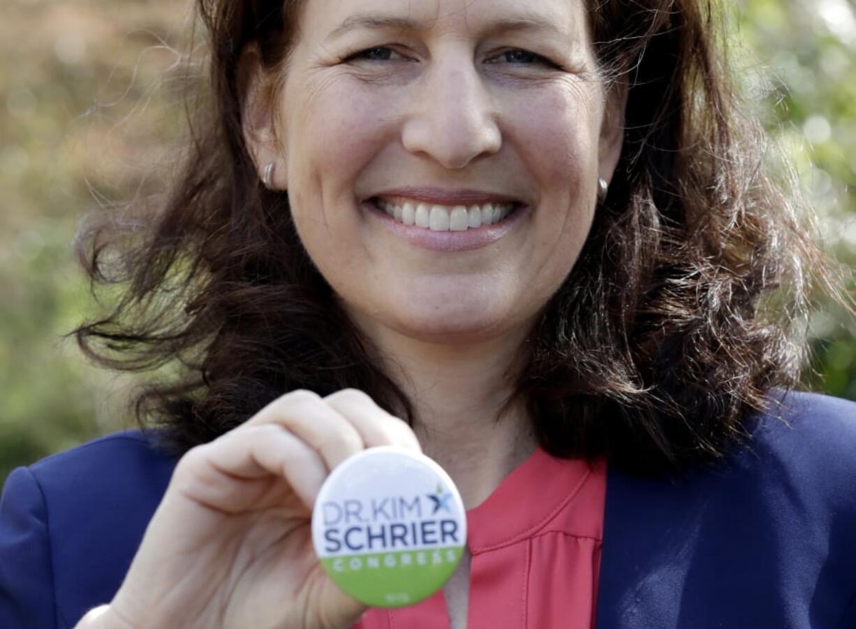 In this photo taken March 30, 2018, Dr. Kim Schrier, a candidate in Washington state’s 8th District race, poses for a photo in Issaquah, Wash. Schrier, a pediatrician who’s leading the Democratic field in fundraising, is among eight unknown Democrats fighting for a spot to challenge the high-profile Republican Dino Rossi. The race is for the seat to succeed retiring incumbent, Rep. Dave Reichert, and represents a district that includes the eastern suburbs of Seattle and stretches into the rural Cascade Mountain region.