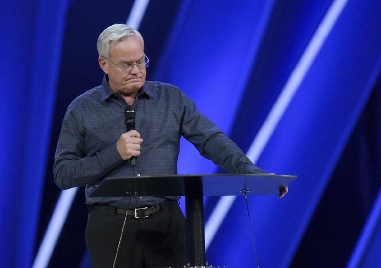 Willow Creek Community Church Senior Pastor Bill Hybels stands before his congregation Tuesday in South Barrington, Ill., where he announced his early retirement effective immediately, amid a cloud of misconduct allegations involving women in his congregation. The announcement was made during a special meeting at the church, one of the nation’s largest evangelical churches, which he founded.