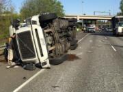 A tractor-trailer rolled onto its side on I-205 southbound Thursday morning in the Salmon Creek area.