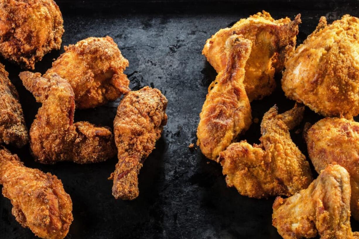 Tasters in the Tribune test kitchen found the chicken fried in oil in a skillet, left, more crispy than pieces cooked in an air fryer, right. But some tasters found the air fried more juicy.