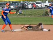 Ridgefield freshman Lily Mittmann tags Woodland's Maddi Bunger at second base during the Spudders' 4-3 win over Woodland in 10 innings on Wednesday, May 2, 2018.