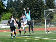 A Mountain View forward challenges Bonney Lake's goalkeeper during the Thunder's 1-0 winner-to-state district extra time win at McKenzie Stadium on Saturday, May 12, 2018 (Andy Buhler/Columbian staff).