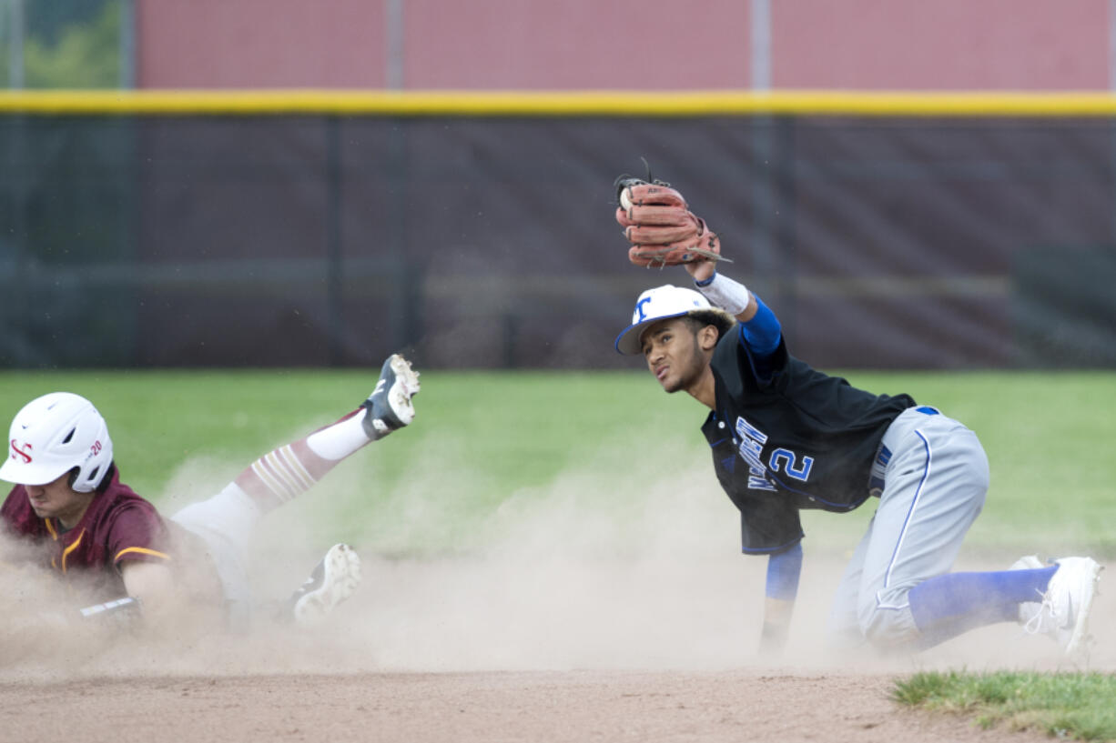 Mountain View’s Isaiah Parker (2) keeps the ball secure in his mitt after tagging out Prairie’s Bret McGuire (20) during the game against Prairie High School in Vancouver on Tuesday afternoon, May 1, 2018. Parker is a junior at Seton Catholic College Preparatory.