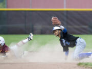 Mountain View’s Isaiah Parker (2) keeps the ball secure in his mitt after tagging out Prairie’s Bret McGuire (20) during the game against Prairie High School in Vancouver on Tuesday afternoon, May 1, 2018. Parker is a junior at Seton Catholic College Preparatory.