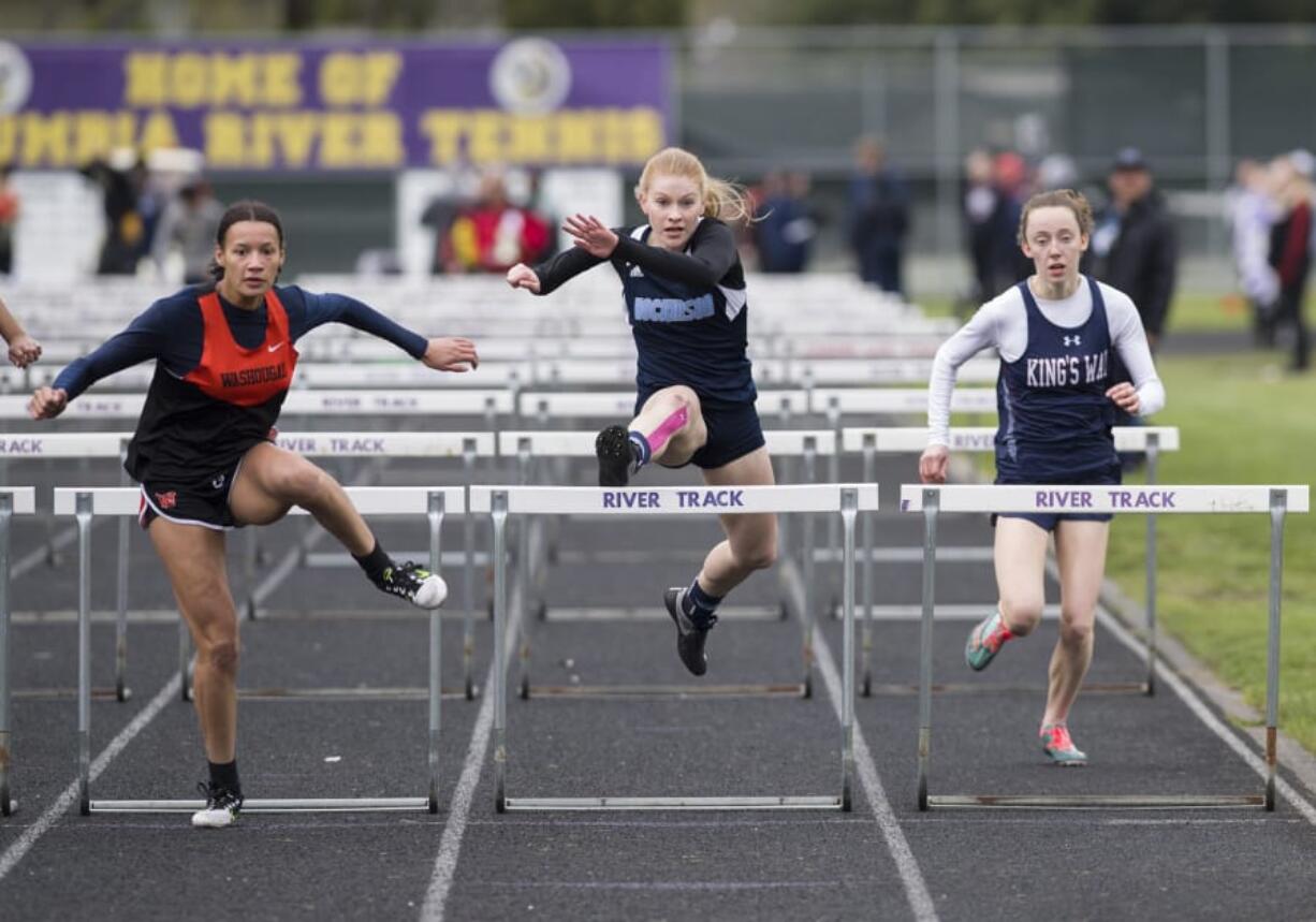 Hockinson senior Alyssa Chapin, center, has learned that having a positive attitude is just as important as speed when competing in the hurdles events in track and field.