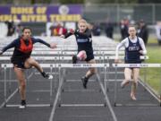 Hockinson senior Alyssa Chapin, center, has learned that having a positive attitude is just as important as speed when competing in the hurdles events in track and field.