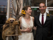 Kristina Geiger and Daniel Sperling at their wedding reception at Como Zoo with Stefano, a two-toed sloth, who was a big hit with guests.