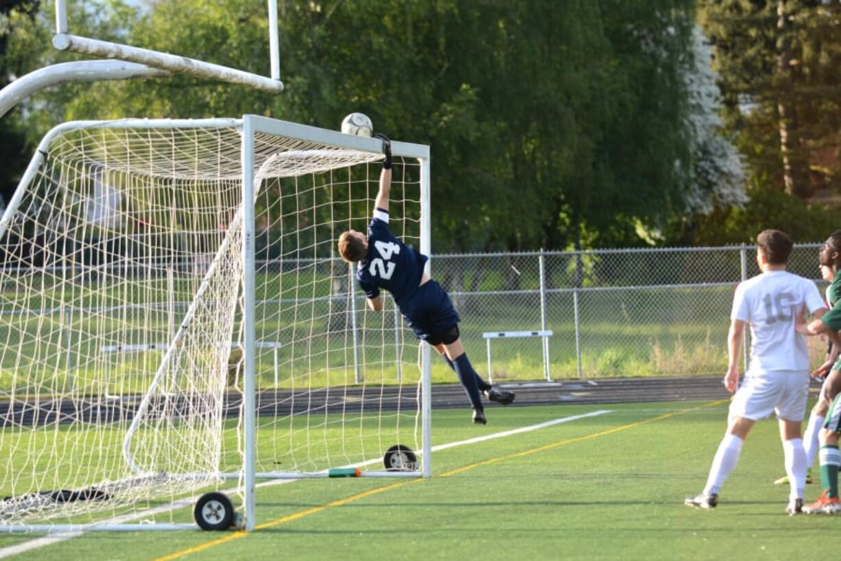 Skyview goalkeeper Dylan Debaldo reaches to push the ball over the crossbar during the Storm’s win over Auburn.