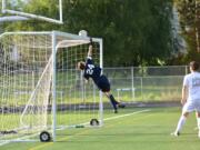 Skyview goalkeeper Dylan Debaldo reaches to push the ball over the crossbar during the Storm’s win over Auburn.