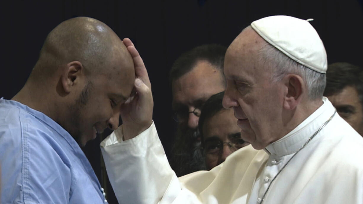 A man in a detention center meets Pope Francis in Wim Wenders’ documentary, “Pope Francis: A Man of His Word.” Neue Road Movies