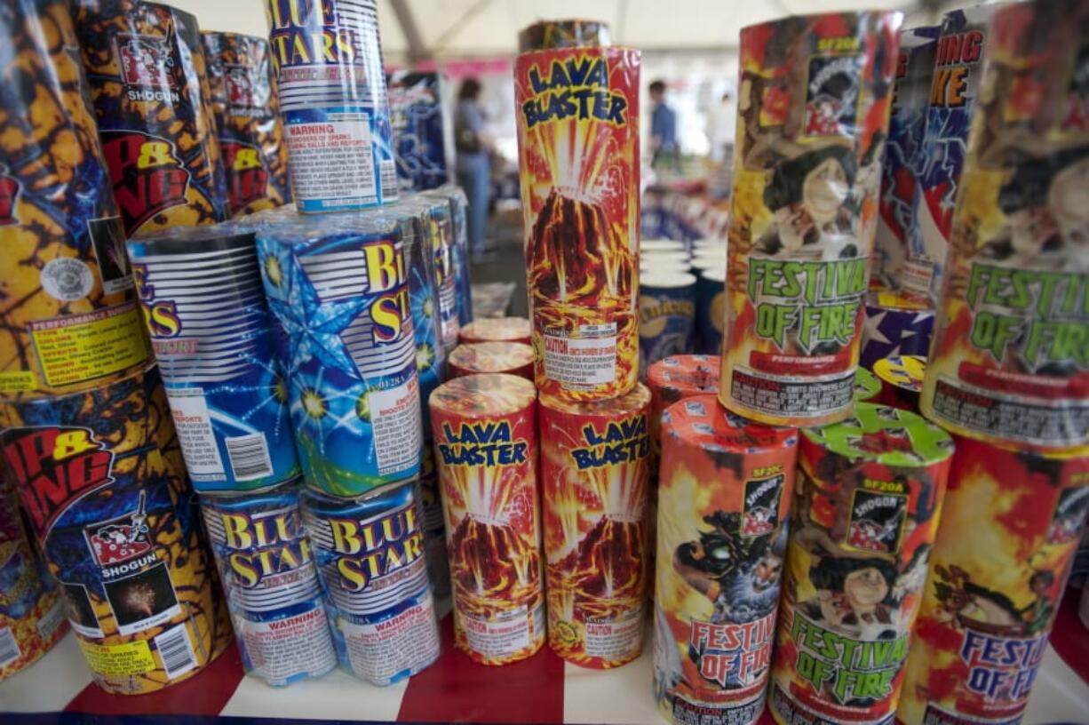 People browse the isles at a fireworks stand benefiting the Brush Prairie Baptist Church Revolution Student Center at NE 63rd Street and NE Andresen Road on Sunday July 1, 2012.