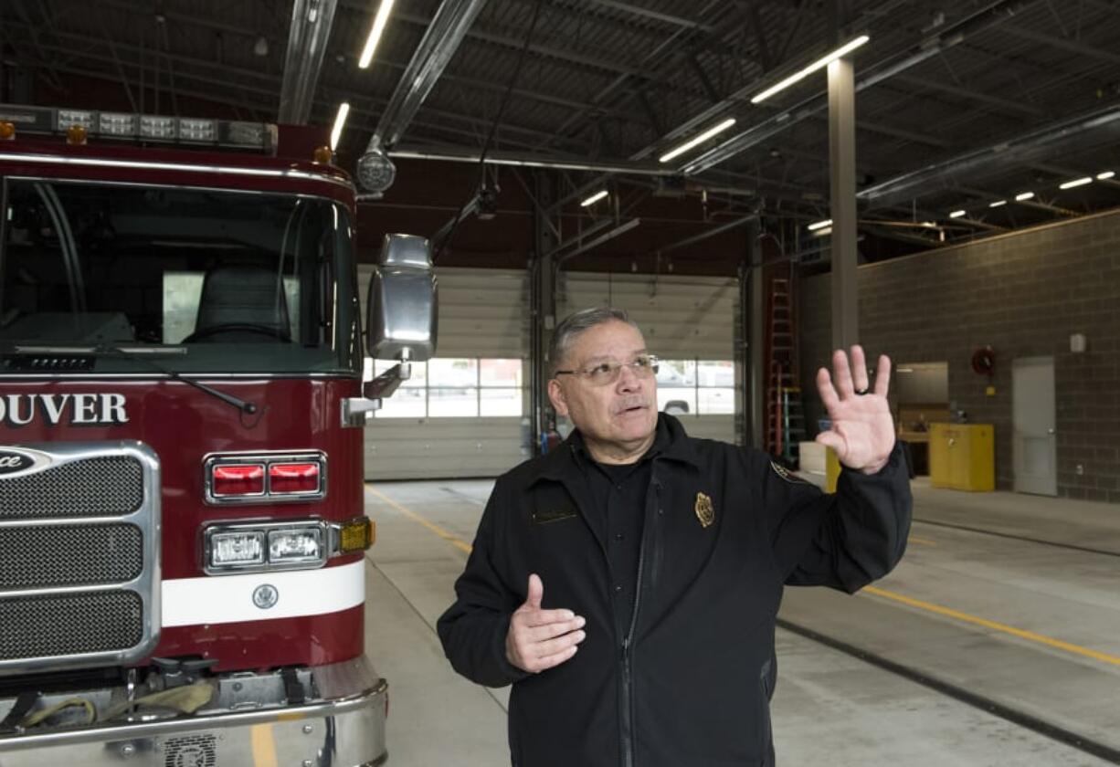 Vancouver Fire Chief Joe Molina explains the traffic signal system around the new Vancouver Fire Station 1 in the station bay in January. He acknowledged more is needed to bring the department and its facilities into the modern age.