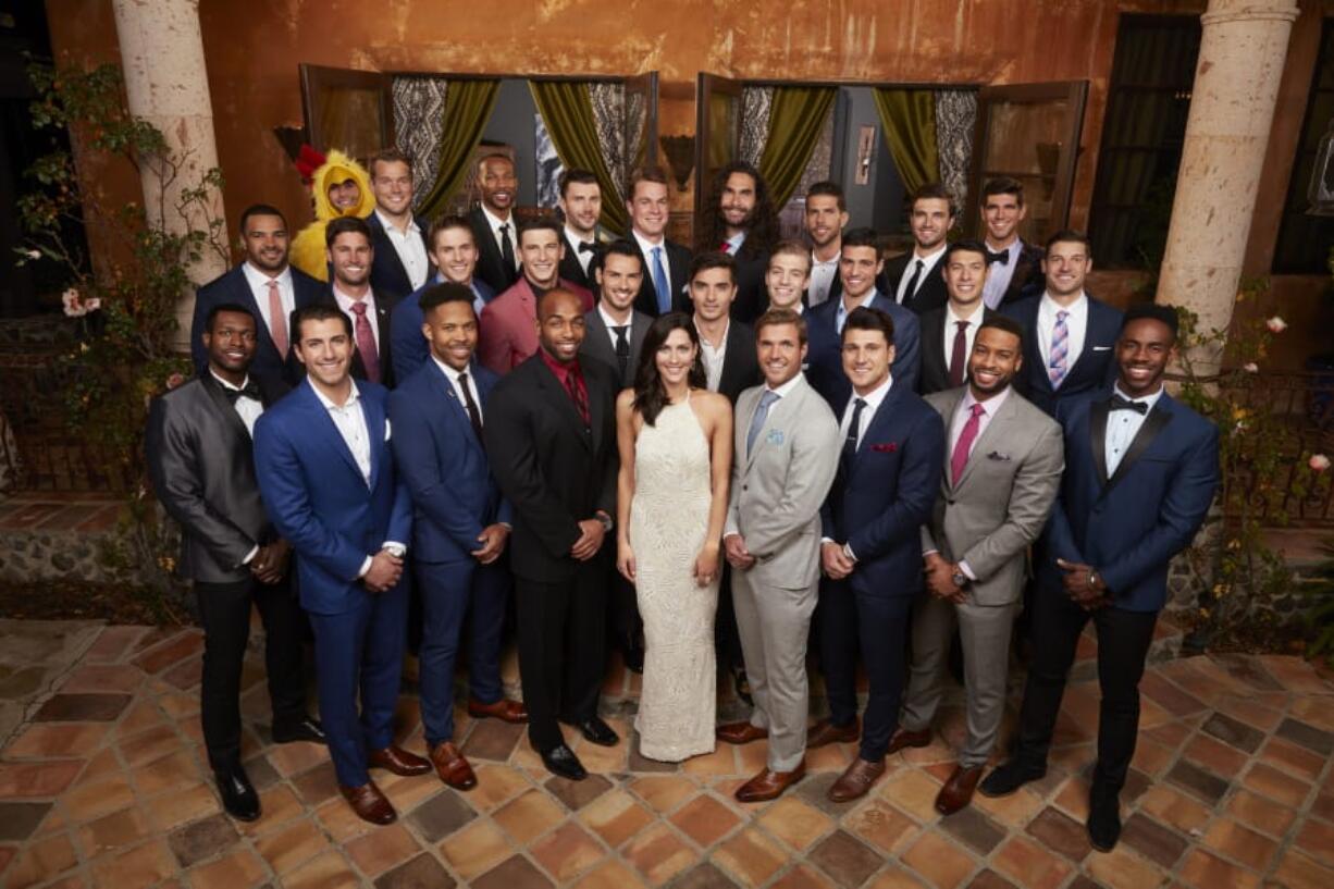 Bachelorette Becca Kuprin surrounded by her 28 suitors during the season premiere May 28.