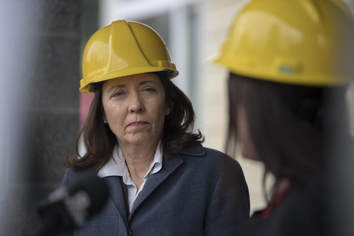 U.S. Sen. Maria Cantwell, D.-Wash., left, listens as Alishia Topper of the Vancouver City Council speaks on the topic of affordable housing at Meriwether Place at the end of March 30.