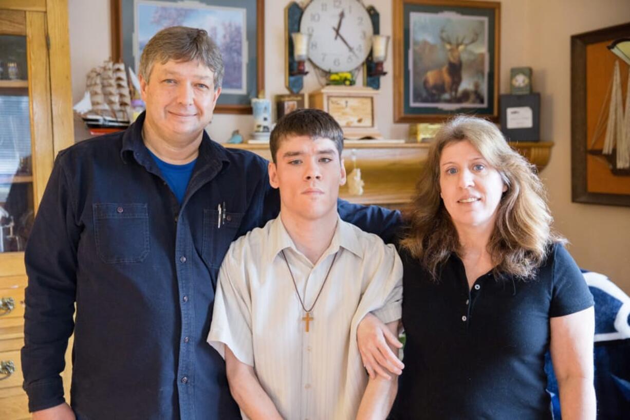 Ben Olson of Camas, left, poses for a family photo. A state-paid caregiver for his medically fragile son, he became disillusioned with the Service Employees International Union.