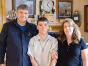 Ben Olson of Camas, left, poses for a family photo. A state-paid caregiver for his medically fragile son, he became disillusioned with the Service Employees International Union.