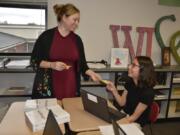 W Washougal High School teacher Vina Black delivers a Smile Gram to Daria Walker during a two-week stretch where students focused on kindness as part of a citywide effort known as #MSDKindness Month.