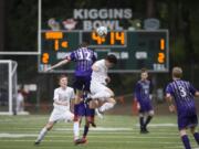 Heritage’s Spencer Clark (12) and Skyview’s Seth Yoshinobu (16) attempt to head the ball during the 4A GSHL boys soccer match at Kiggins Bowl.