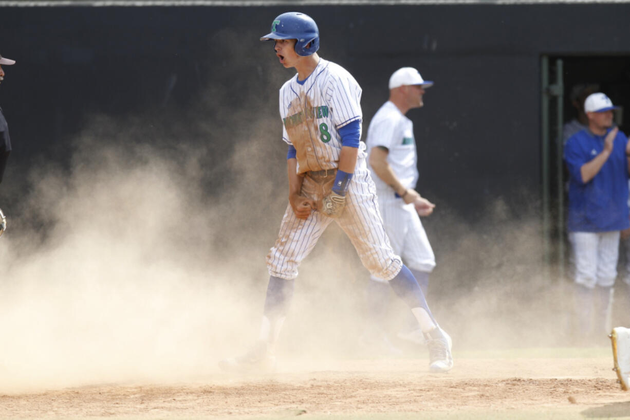 Mountain View infielder Quinn Rooks reacts to scoring against Yelm in a 3A bi-district baseball tournament game at Propstra Stadium.