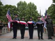 A multi-agency color guard presented and raised the flag during the Law Enforcement Memorial Ceremony outside the Clark County Public Service Center in Vancouver on Thursday, May 17, 2018.