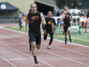 Prairie’s Nolan Mickenham crosses the finish line during the 200-meter run at the second day of the 4A, 3A district track and field meet at McKenzie Stadium in Vancouver on Thursday, May 10, 2018.