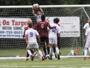 Columbia River goalkeeper David Gonzalez-Martinez, 0, blocks a goal during the first round of the Class 2A state playoffs at Kiggins Bowl in Vancouver on Wednesday, May 16, 2018.