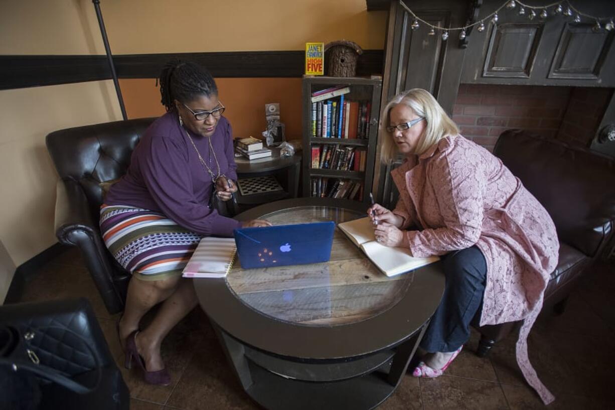 Carol Parker Walsh with Evolve Image Consulting, left, meets with client Twila Kaye at Di Tazza in southeast Vancouver. Walsh started her consulting and coaching business after a serious auto accident and other personal challenges.