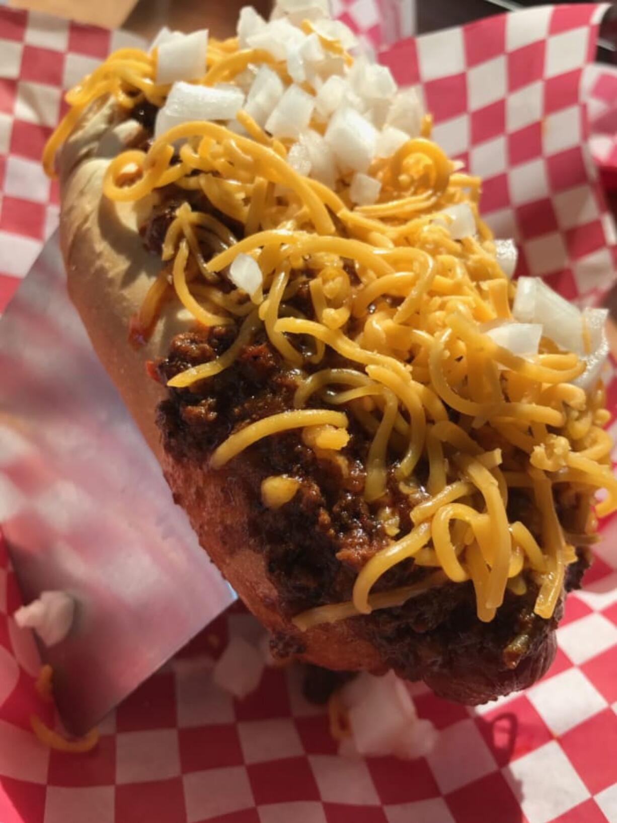 The Beef Chili Dog from Maddogs Gourmet Hot Dogs contains no beans and pairs with brown ale.