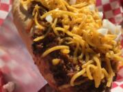 The Beef Chili Dog from Maddogs Gourmet Hot Dogs contains no beans and pairs with brown ale.