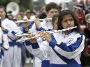 Daisy Iturbide, a seventh-grader at Discovery Middle School, plays in the Discovery Middle School band during the parade on Saturday. It’s the second year the flutist has marched in the annual parade. “It’s my favorite part of the year,” she said.