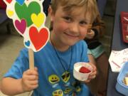 East Vancouver: Burton Elementary School student Frankie DiPietra shows his approval of the local strawberries featured in the most recent Harvest of the Month tasting.