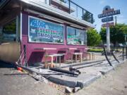 The aftermath of a deadly car crash at the Igloo Restaurant in Vancouver is pictured on Saturday. Three people died and one was injured in the accident on Friday.