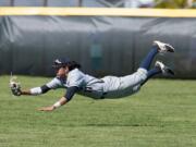 King's Way Christian center fielder Sam Lauderdale makes a diving catch in the fourth inning of the Knights' 4-2 win over Montesano in the District 4 title game Saturday at Castle Rock.